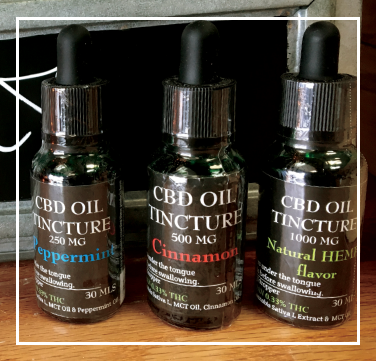three dropper bottles of assorted flavers of CBD Oil Tincture